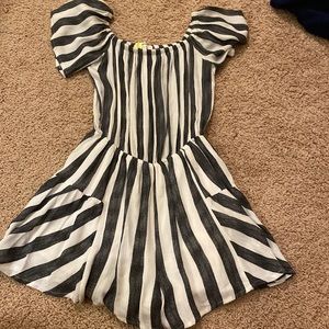 dark gray and white frilly romper the shorts flare out and they’re super cute